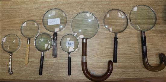 Eight umbrella / flatware handled magnifying glasses